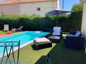 Villas Villa climatisee a 3 min du centre ville a pied. : photos des chambres