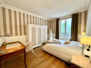 Appartements La Belle Epoque a Reims : photos des chambres