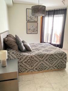 Elegant 2-Bedroom Apartment in Benidorm with Private Pool and Scenic Garden Views