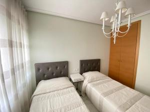 Elegant 2-Bedroom Apartment in Benidorm with Private Pool and Scenic Garden Views