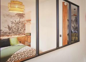 Appartements La Belle Mer by MRODBNB - Appart Neuf - Apercu Mer - 25m Plage & Resto - Cine - Cheminee - Popcorn : photos des chambres