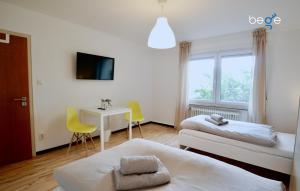 BEGE APARTMENTS: COMPANY COMFORT