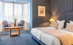 Hotels Grand Hotel Des Templiers : photos des chambres