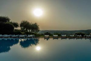 AffittiBreviSiena - Palazzo Monaci Appartamento con piscina nelle crete Senesi
