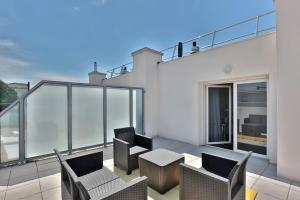 Appartements Le Tyrossais - Terrasses - Parking : photos des chambres