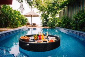 Reethi Faru Resort - Stay 5 Nights or More and Enjoy a Free Sunset Cruise