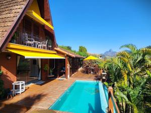 obrázek - Casa Serrana, 4 quartos com ar e piscina aquecida em meio à Natureza de Itaipava