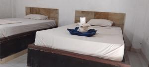 Amed Stop Inn Homestay, Rooftop Restaurant and Bar