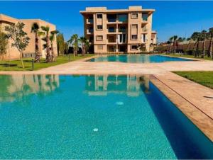 Magnifique appartement Les perles de marrakech lux avec 2 piscines