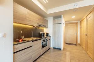 Appartement Haute gamme ski aux pieds, piscine, sauna.