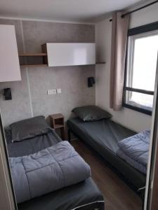 Maisons de vacances Camping Officiel Siblu Le Pipiou : photos des chambres