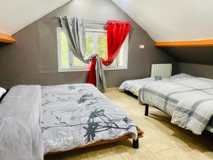 Appartements Maison et sa dependance ss voisinage dans les vergers de Montmorency : photos des chambres