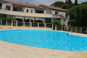 Appartements La Bastide - 4 couchages avec piscine & climatise : photos des chambres