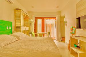 Casa dAroeira Residencial Boutique - Centro de Juqueí - Perto de Tudo - 2 quadras do Mar - Serviço de Praia - Roupa de Cama 600 fios algodão Egípcio - Tudo Novo - Estacionamento Interno - Cozinha - Consulte unidades com Ofurô Hidro e Cromoterapi