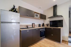 Appartements LE CAVEAU : photos des chambres