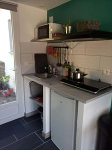 Maisons de vacances Petite maison avec jardin entre lac et village : photos des chambres