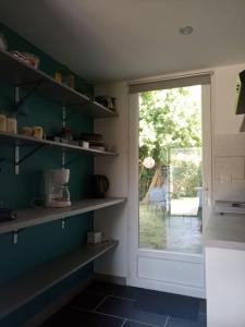 Maisons de vacances Petite maison avec jardin entre lac et village : photos des chambres