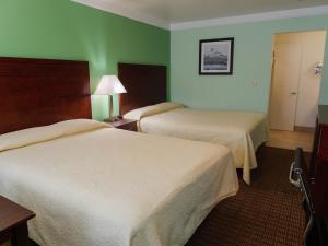 Queen Room with Two Queen Beds room in Sweet Home Inn
