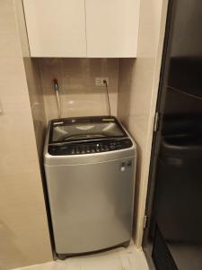 81 Newport C5 10i Balcony & Pool across NAIA T3