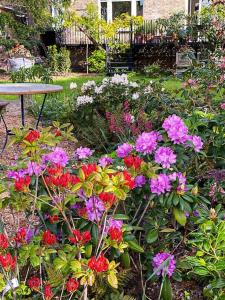 Elegant 2-Bedroom Getaway w Terrace & Garden Views