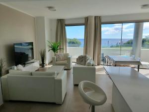 Luxury beachfront apartment with pool, sauna, fitness and gym in province Malaga, Andalusia