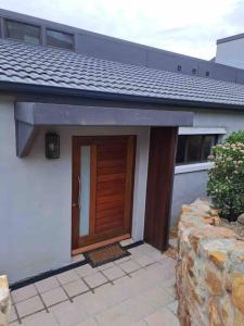 Modern mountainside home with ocean view - Minimal load shedding