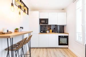 Appartements GuestReady - Charm stay in Courbevoie : photos des chambres