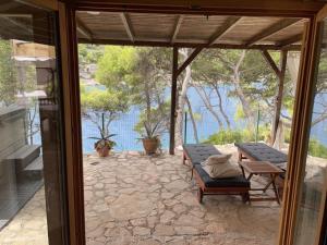 Apartment by the sea Žirje with private heated hydromassage pool