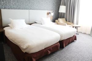 Hotels Hilton Paris Charles De Gaulle Airport : Chambre Lits Jumeaux Deluxe