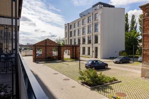 Apartment with Balcony & Parking Near Manufaktura Łódź by Renters Prestige