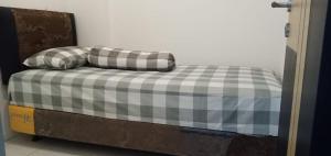 Apartemen 32 m2 dengan 2 kamar tidur dan 1 kamar mandi pribadi di Gresik