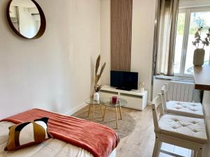 Appartements L’evasion - Studio cosy en centre ville : photos des chambres