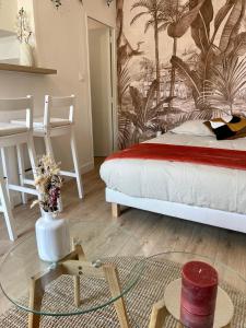 Appartements L’evasion - Studio cosy en centre ville : photos des chambres