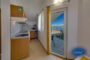 Holiday apartment in Razanj with sea view, terrace, air conditioning, WiFi 4773-3