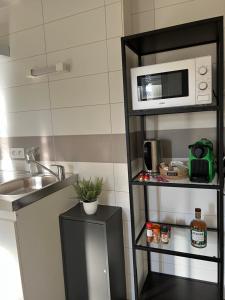 Appartements Cosy Studio hyper centre avec kitchenette et Clim : photos des chambres