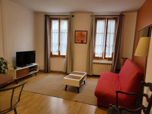 Appartements Logements A 2 PETITS PAS : photos des chambres