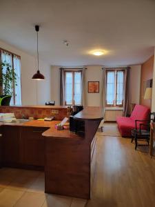 Appartements Logements A 2 PETITS PAS : photos des chambres