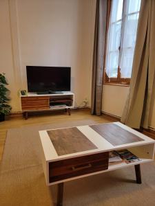 Appartements Logements A 2 PETITS PAS : photos des chambres