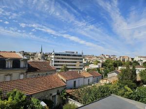 Appartements Le Bienheureux, le calme en ville et jardin : photos des chambres