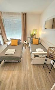 Appartements 7mn de Deauville Jardin Wifi Box TV : photos des chambres