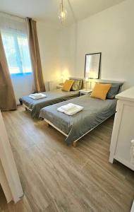 Appartements 7mn de Deauville Jardin Wifi Box TV : photos des chambres