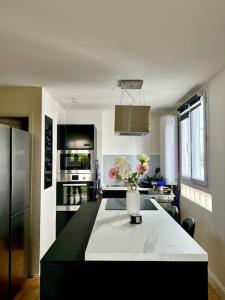 Appartements Cosy T3 Tout Confort - Metro Barriere de Paris : photos des chambres