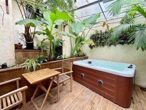 Appartements myinsolite - Cocon Tropical, jacuzzi, enigme : photos des chambres