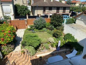 Appartements Appartement spacieux dans maison avec terrasse et jardin : photos des chambres