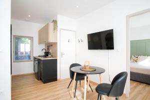 Appartements La Capsule - Appartement Design et Cosy : photos des chambres