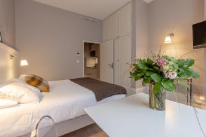 Appartements La Maison Blanche - AppartHotels climatises de charme Chic & Cosy - Centre-ville : photos des chambres