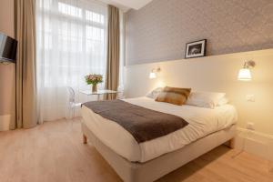 Appartements La Maison Blanche - AppartHotels climatises de charme Chic & Cosy - Centre-ville : photos des chambres