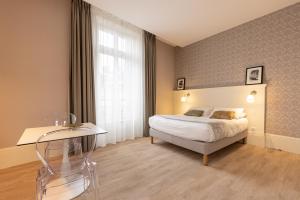 Appartements La Maison Blanche - AppartHotels climatises de charme Chic & Cosy - Centre-ville : photos des chambres