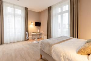 Appartements La Maison Blanche - AppartHotels de charme Chic & Cosy a 350m du coeur de ville de Limoges - Acces autonome : photos des chambres