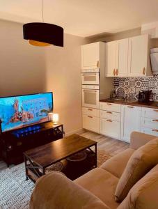 Appartements Charmant studio avec jardin : photos des chambres